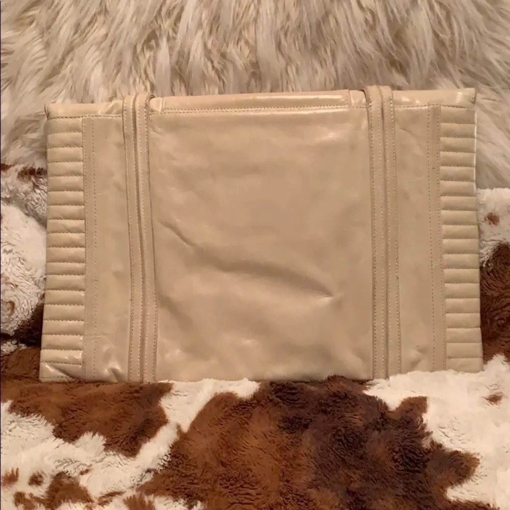 Reece Hudson cream colored clutch‎